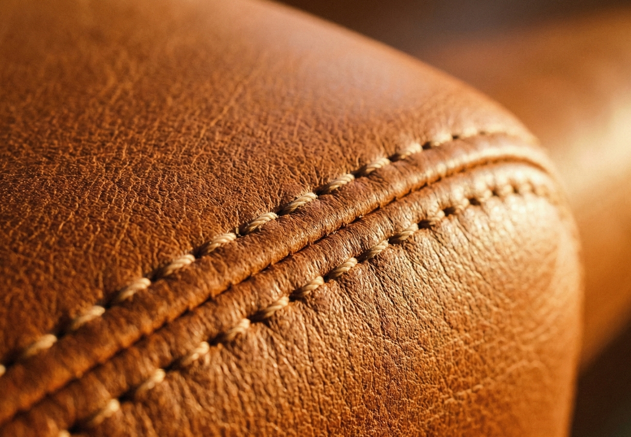 Close-up of high-quality top-grain leather stitching.